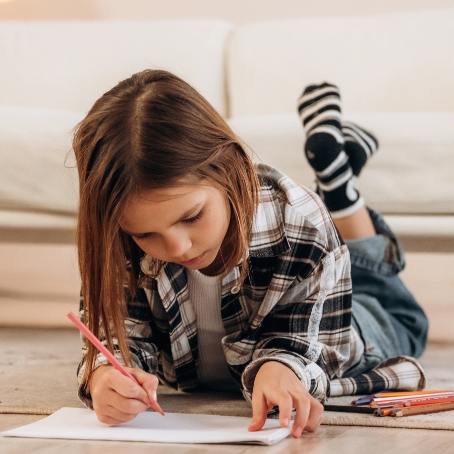 Child drawing on floor